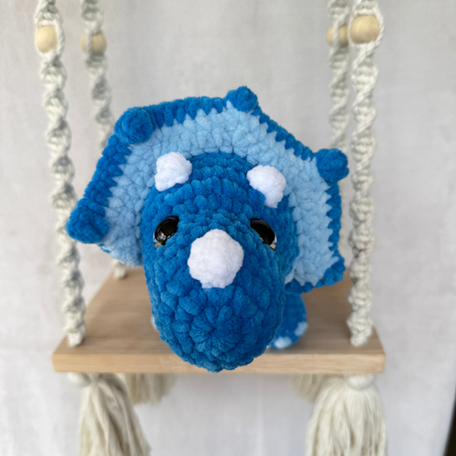 Handmade blue standing triceratops crochet plush made with soft plush yarn and adorable dinosaur details