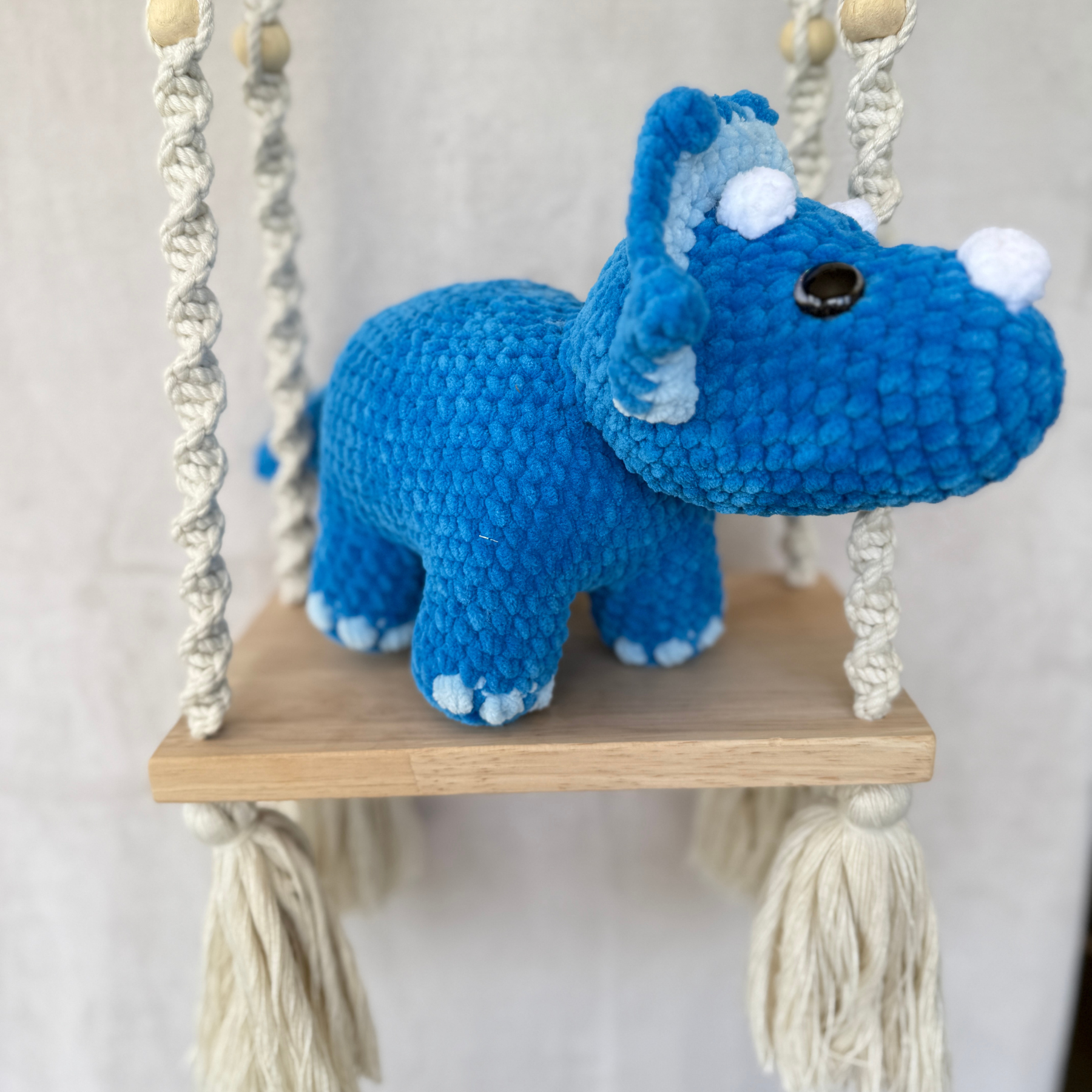 Handmade blue standing triceratops crochet plush made with soft plush yarn and adorable dinosaur details