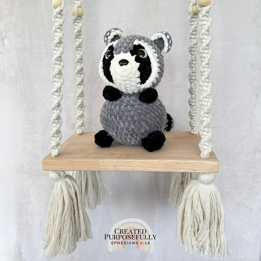 Handmade crochet raccoon plush with a classic masked face made with soft cuddly yarn by Created Purposefully