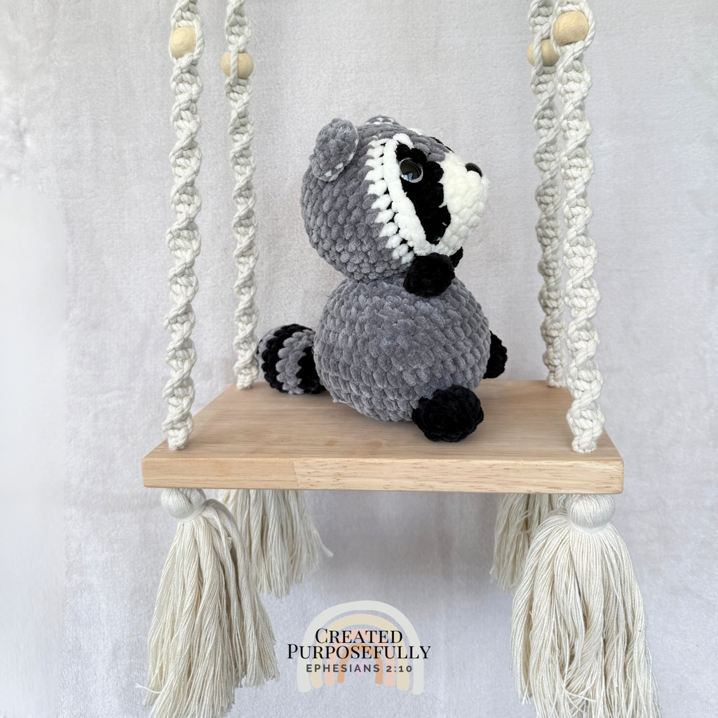 Handmade crochet raccoon plush with a classic masked face made with soft cuddly yarn by Created Purposefully