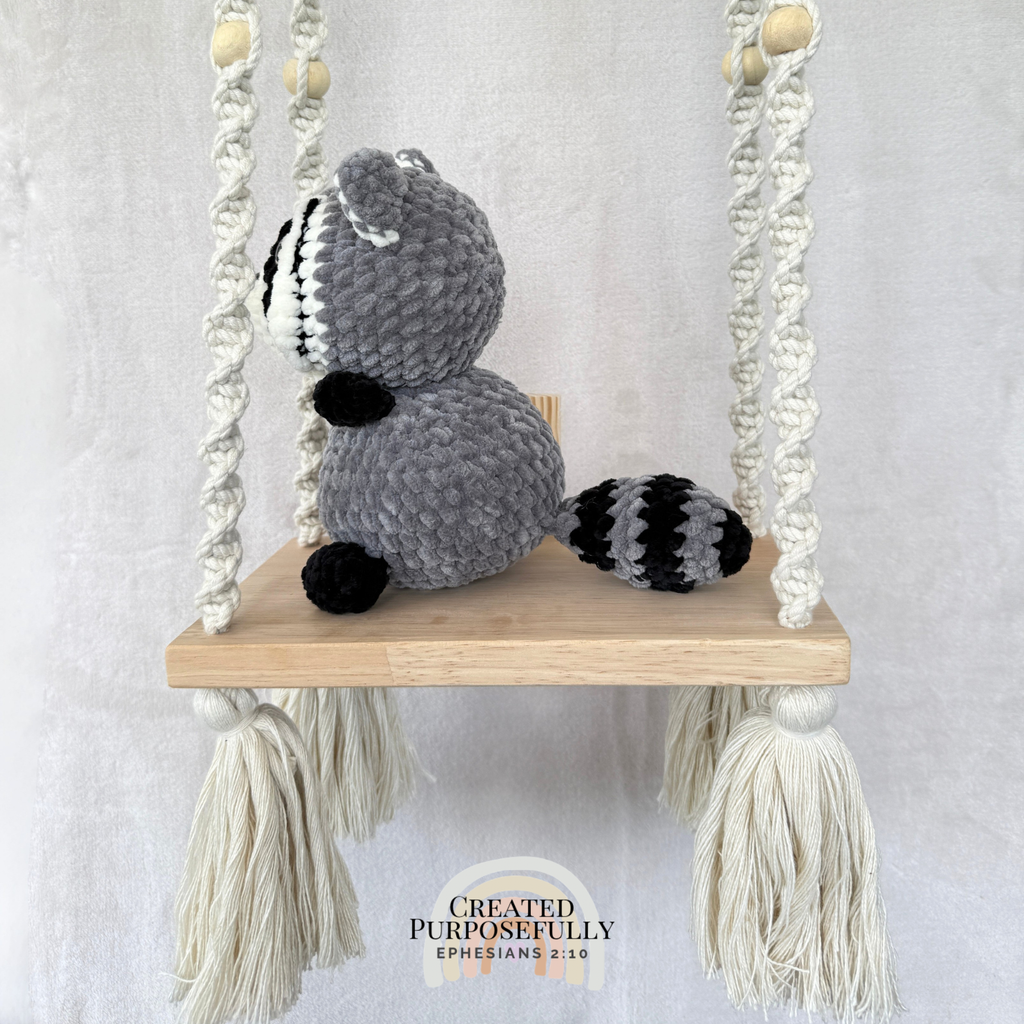 Handmade crochet raccoon plush with a classic masked face made with soft cuddly yarn by Created Purposefully