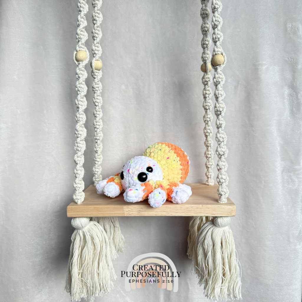 Handmade crochet spider plush with eight legs made with soft cuddly yarn by Created Purposefully