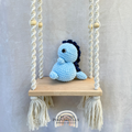 Handmade crochet Stegosaurus dinosaur plush with colorful back plates and soft cuddly yarn by Created Purposefully