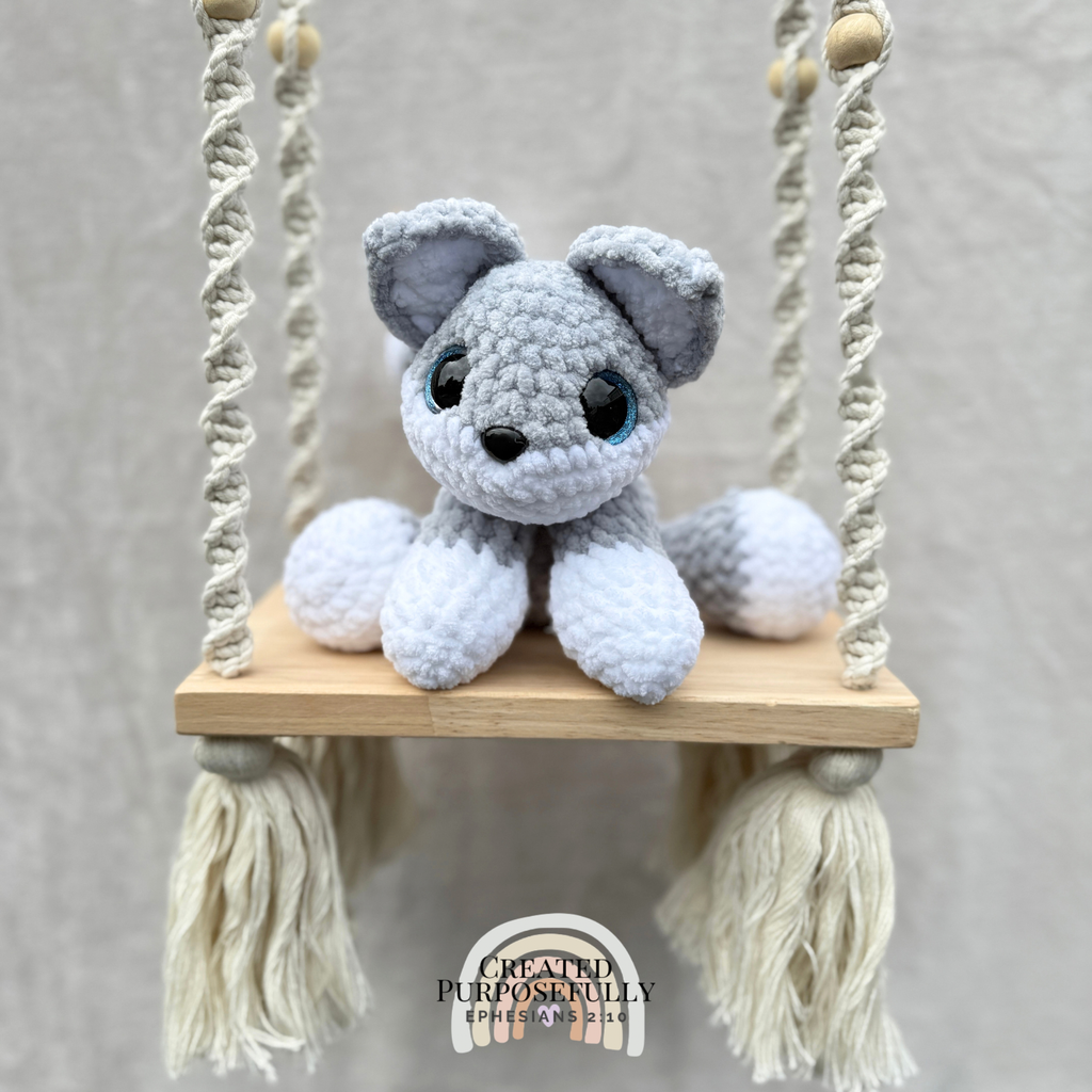 Handmade crochet wolf plush with pointed ears and fluffy tail made with soft cuddly yarn by Created Purposefully