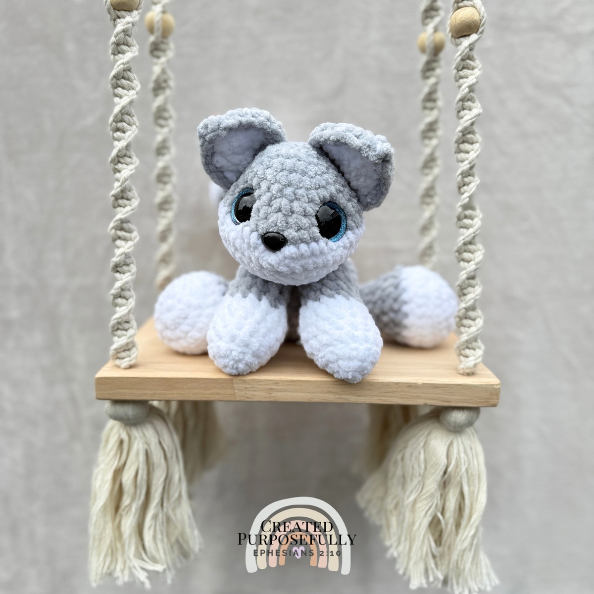Handmade crochet wolf plush with pointed ears and fluffy tail made with soft cuddly yarn by Created Purposefully