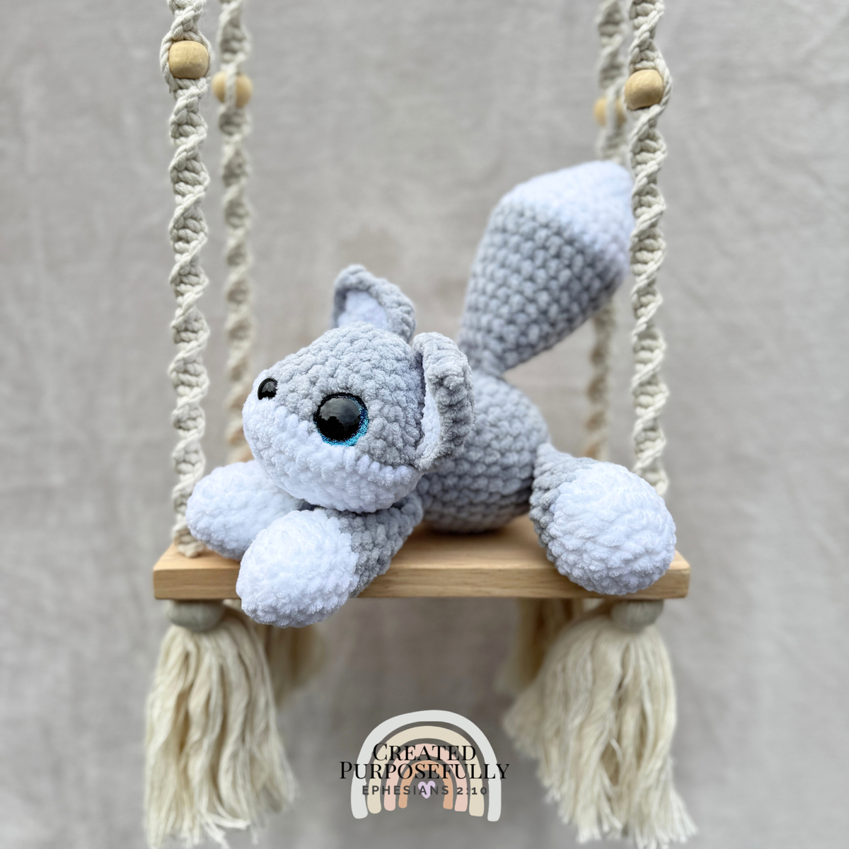 Handmade crochet wolf plush with pointed ears and fluffy tail made with soft cuddly yarn by Created Purposefully