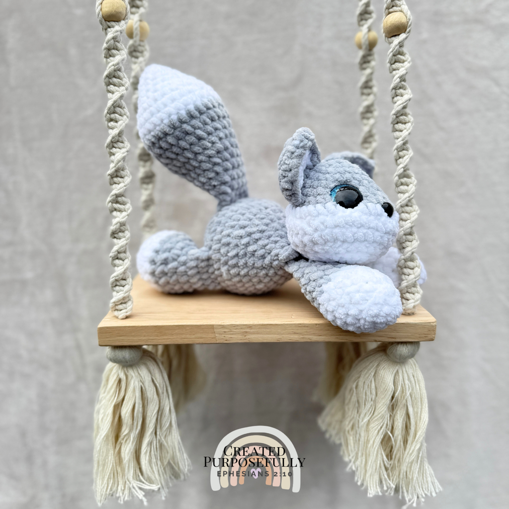 Handmade crochet wolf plush with pointed ears and fluffy tail made with soft cuddly yarn by Created Purposefully