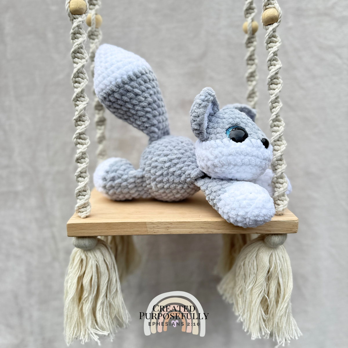 Handmade crochet wolf plush with pointed ears and fluffy tail made with soft cuddly yarn by Created Purposefully