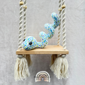 Handmade curled crochet snake plush in a coiled shape made with soft cuddly yarn by Created Purposefully