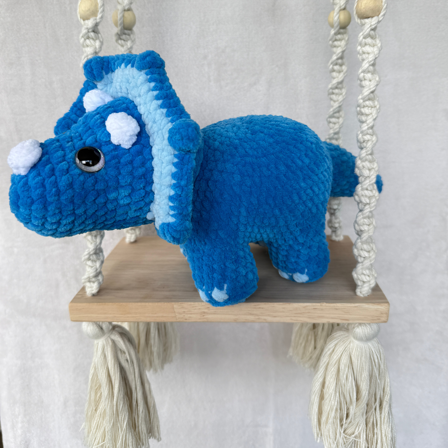 Handmade blue standing triceratops crochet plush made with soft plush yarn and adorable dinosaur details
