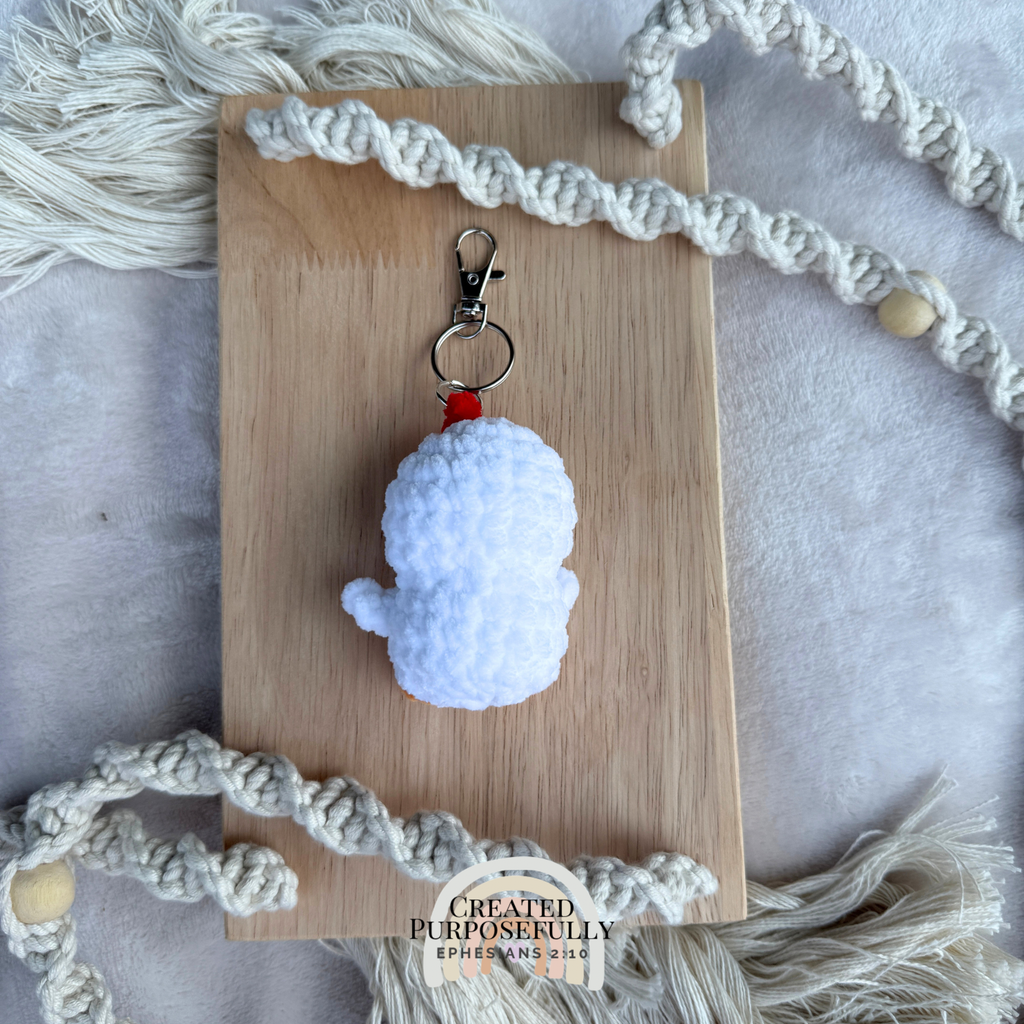 Handmade crochet chicken backpack buddy keychain made with soft plush yarn, a cute bag charm for backpacks, purses, keys, and gifts.
