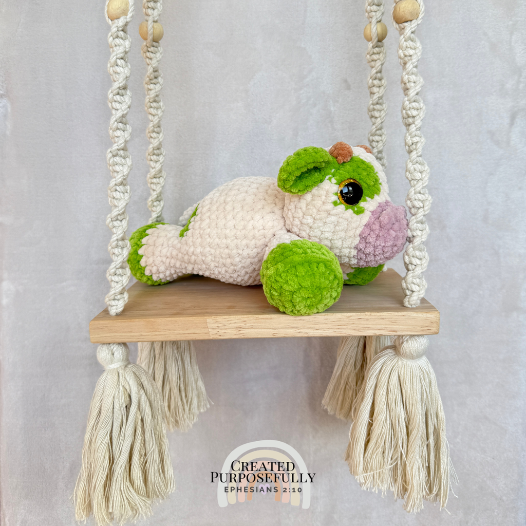 Handmade crochet cow plush made with soft plush yarn and adorable handmade details