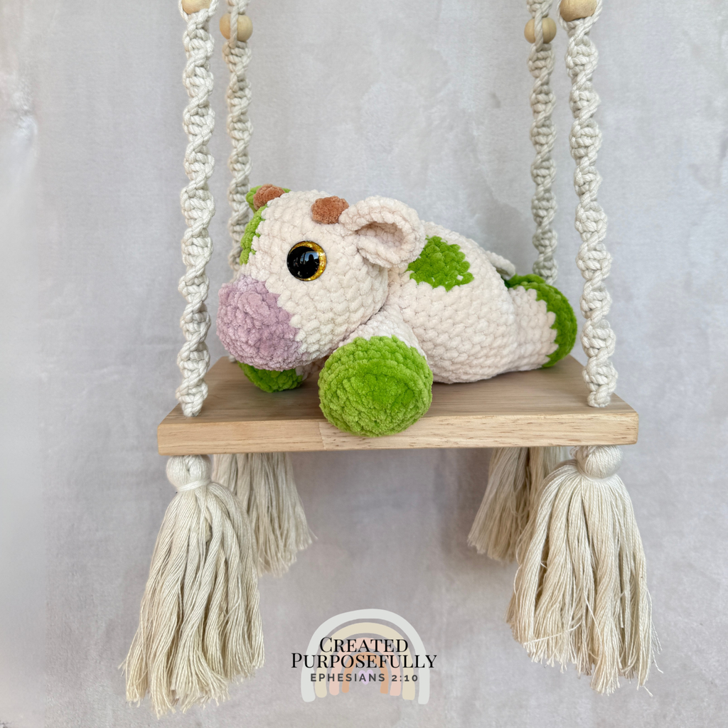 Handmade crochet cow plush made with soft plush yarn and adorable handmade details