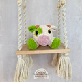 Handmade crochet cow plush made with soft plush yarn and adorable handmade details