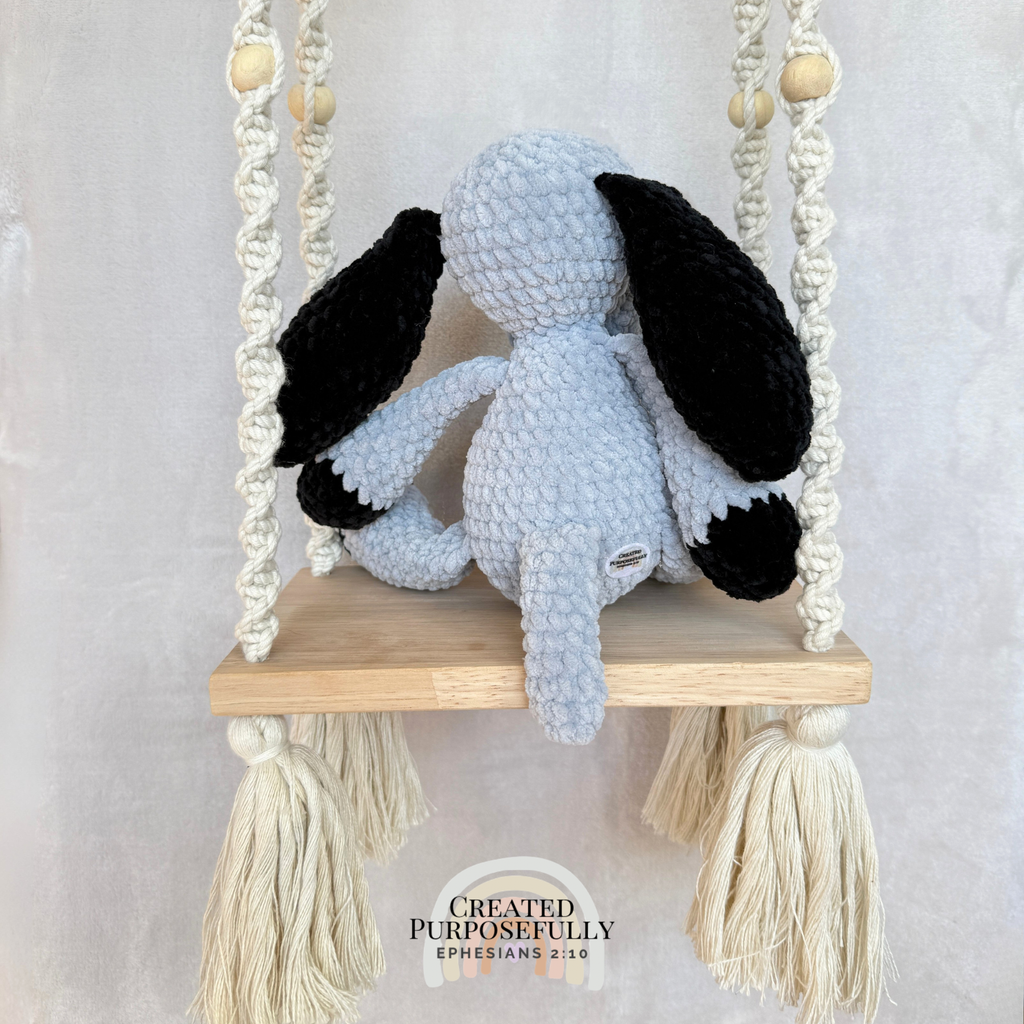 Handmade gray and tan crochet dog plush made with soft plush yarn and adorable handmade details