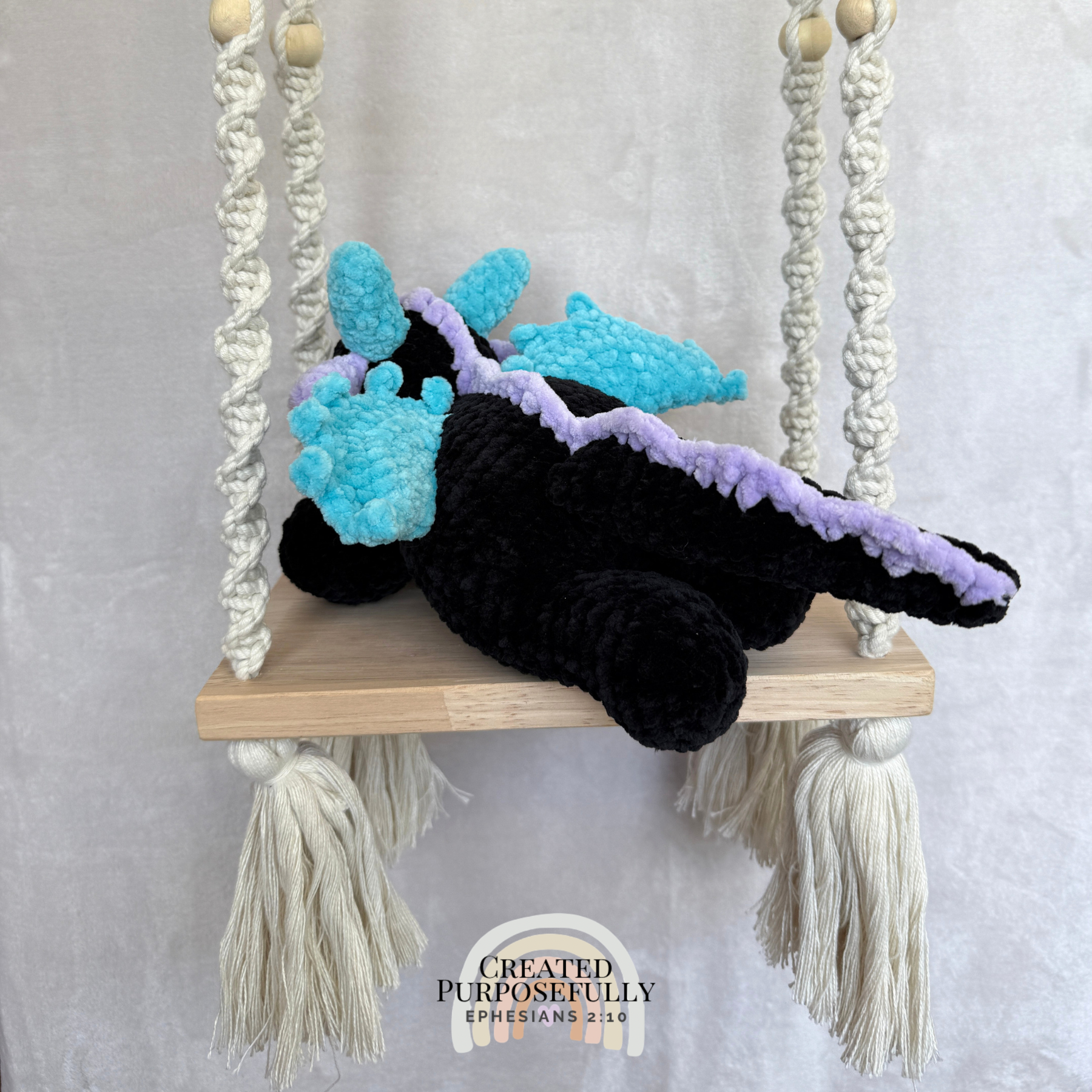 Handmade crochet dragon plush made with soft plush yarn featuring wings and adorable handmade details