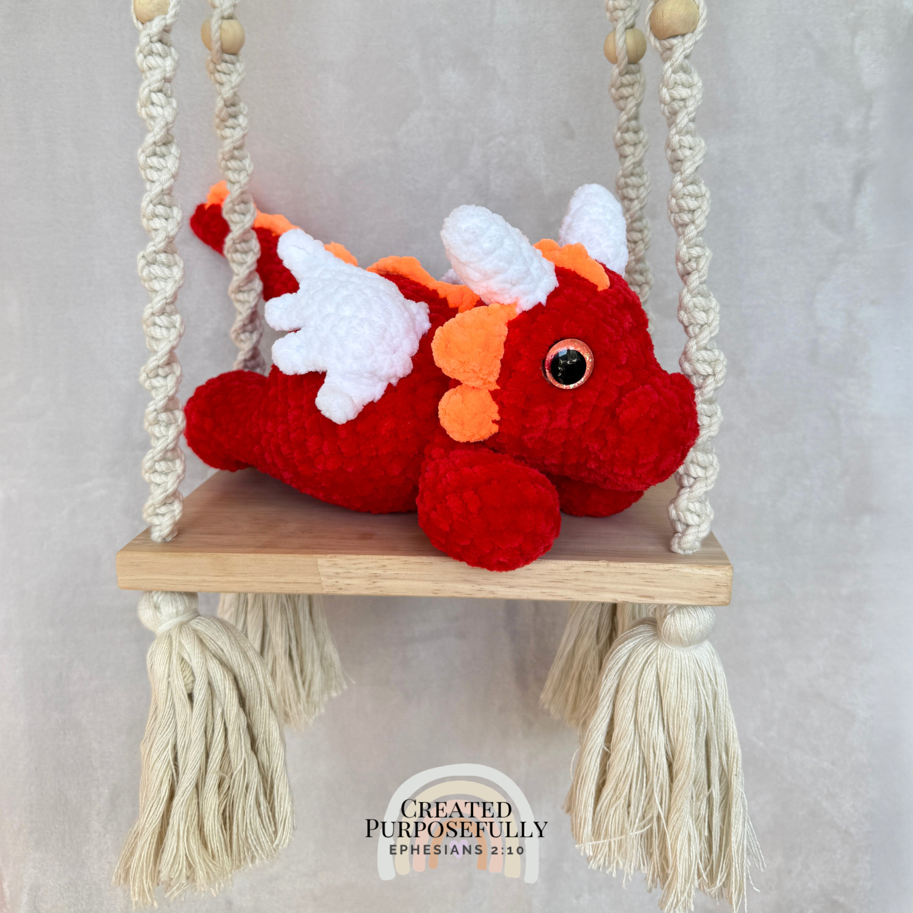 Handmade crochet dragon plush made with soft plush yarn featuring wings and adorable handmade details
