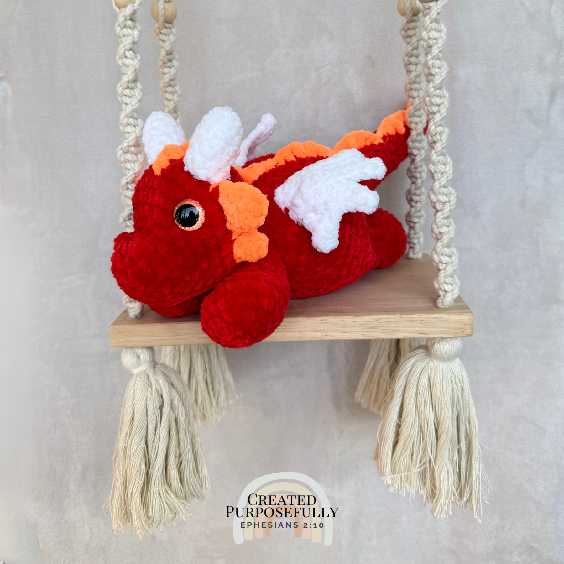 Handmade crochet dragon plush made with soft plush yarn featuring wings and adorable handmade details