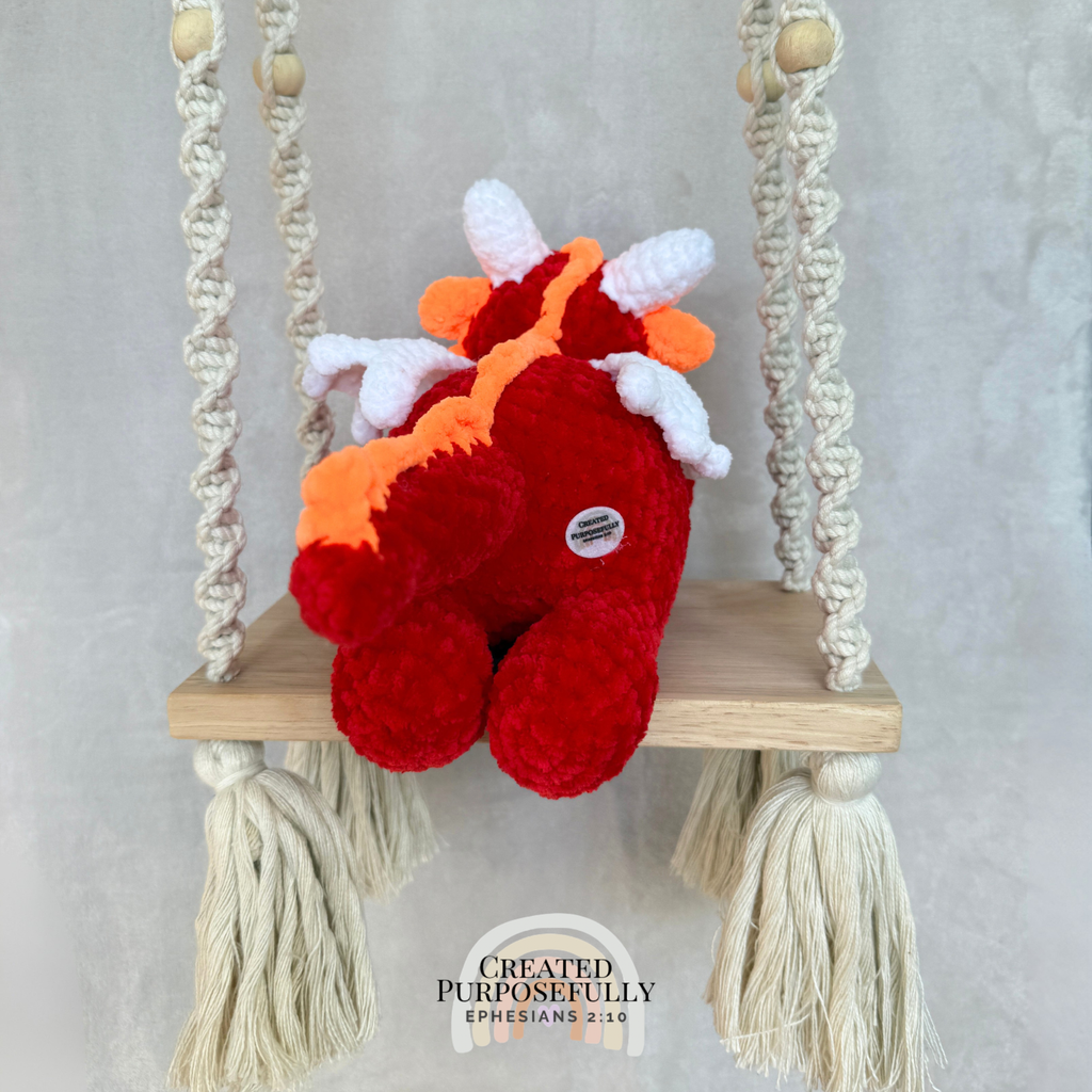Handmade crochet dragon plush made with soft plush yarn featuring wings and adorable handmade details