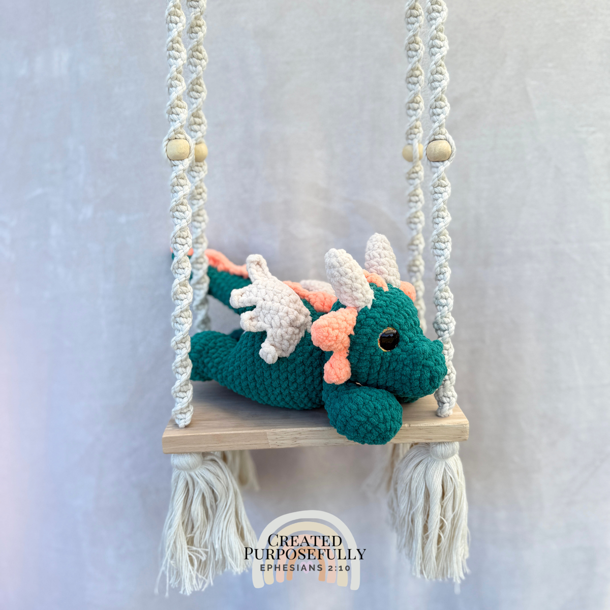 Handmade crochet dragon plush made with soft plush yarn featuring wings and adorable handmade details