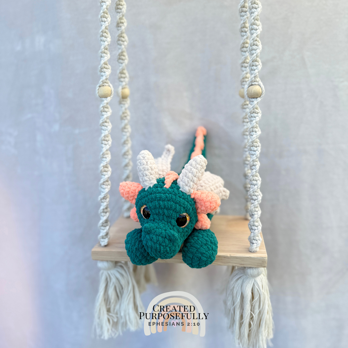 Handmade crochet dragon plush made with soft plush yarn featuring wings and adorable handmade details