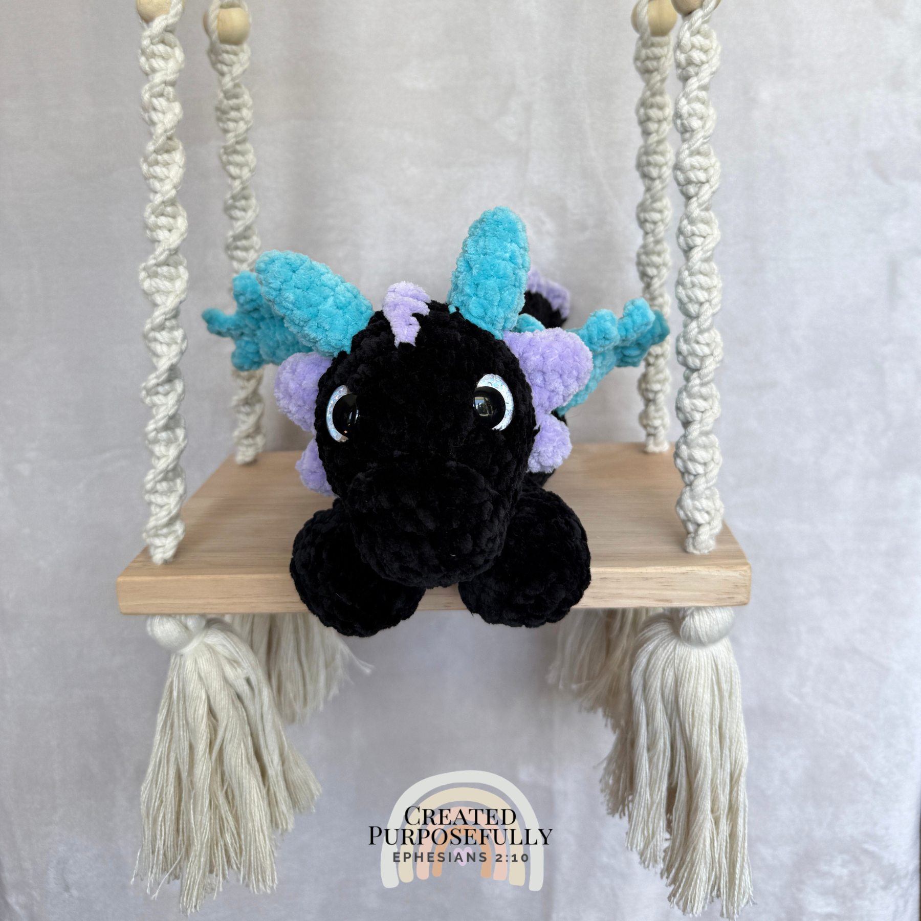 Handmade crochet dragon plush made with soft plush yarn featuring wings and adorable handmade details