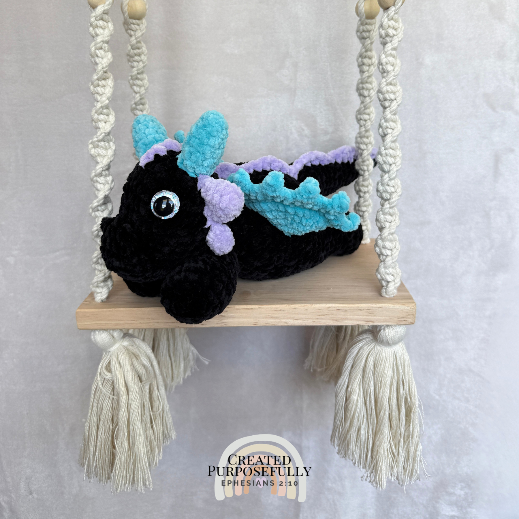 Handmade crochet dragon plush made with soft plush yarn featuring wings and adorable handmade details