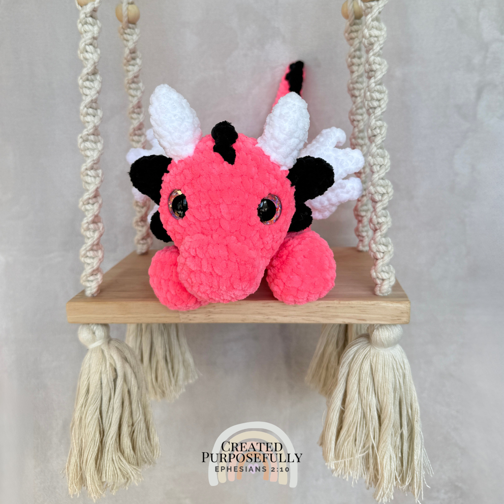 Handmade crochet dragon plush made with soft plush yarn featuring wings and adorable handmade details