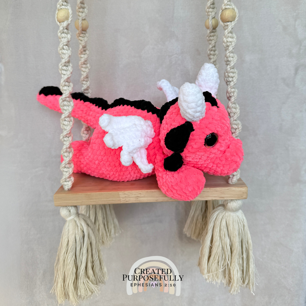 Handmade crochet dragon plush made with soft plush yarn featuring wings and adorable handmade details