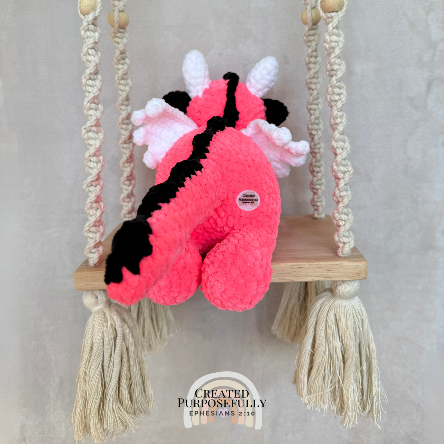 Handmade crochet dragon plush made with soft plush yarn featuring wings and adorable handmade details