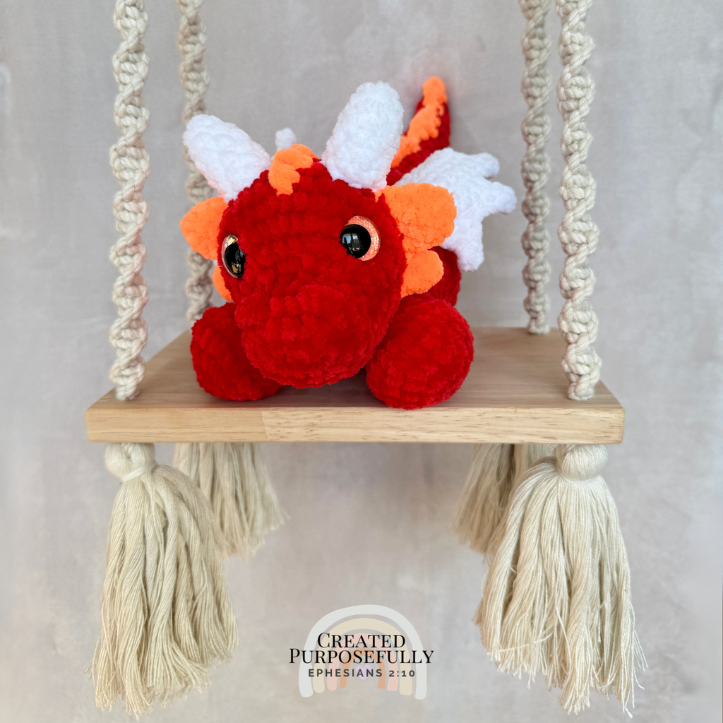 Handmade crochet dragon plush made with soft plush yarn featuring wings and adorable handmade details