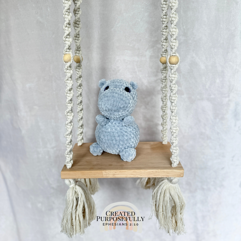 Shop a sweet handmade crochet hippo made with soft plush yarn. Choose your favorite color for a cuddly handmade gift perfect for kids and hippo lovers.