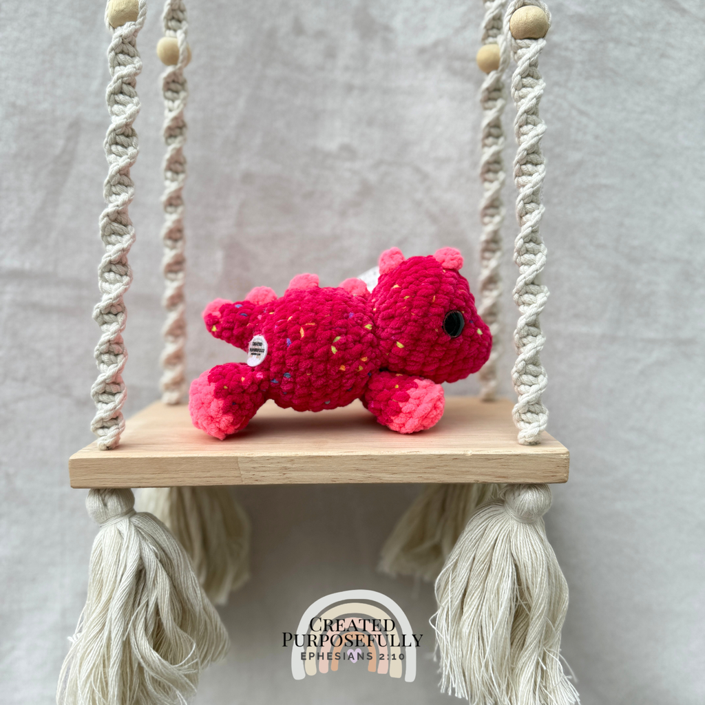 Handmade crochet mini Stegosaurus plush made with soft plush yarn, a cute stuffed dinosaur gift for kids, dino lovers, and plush collectors.