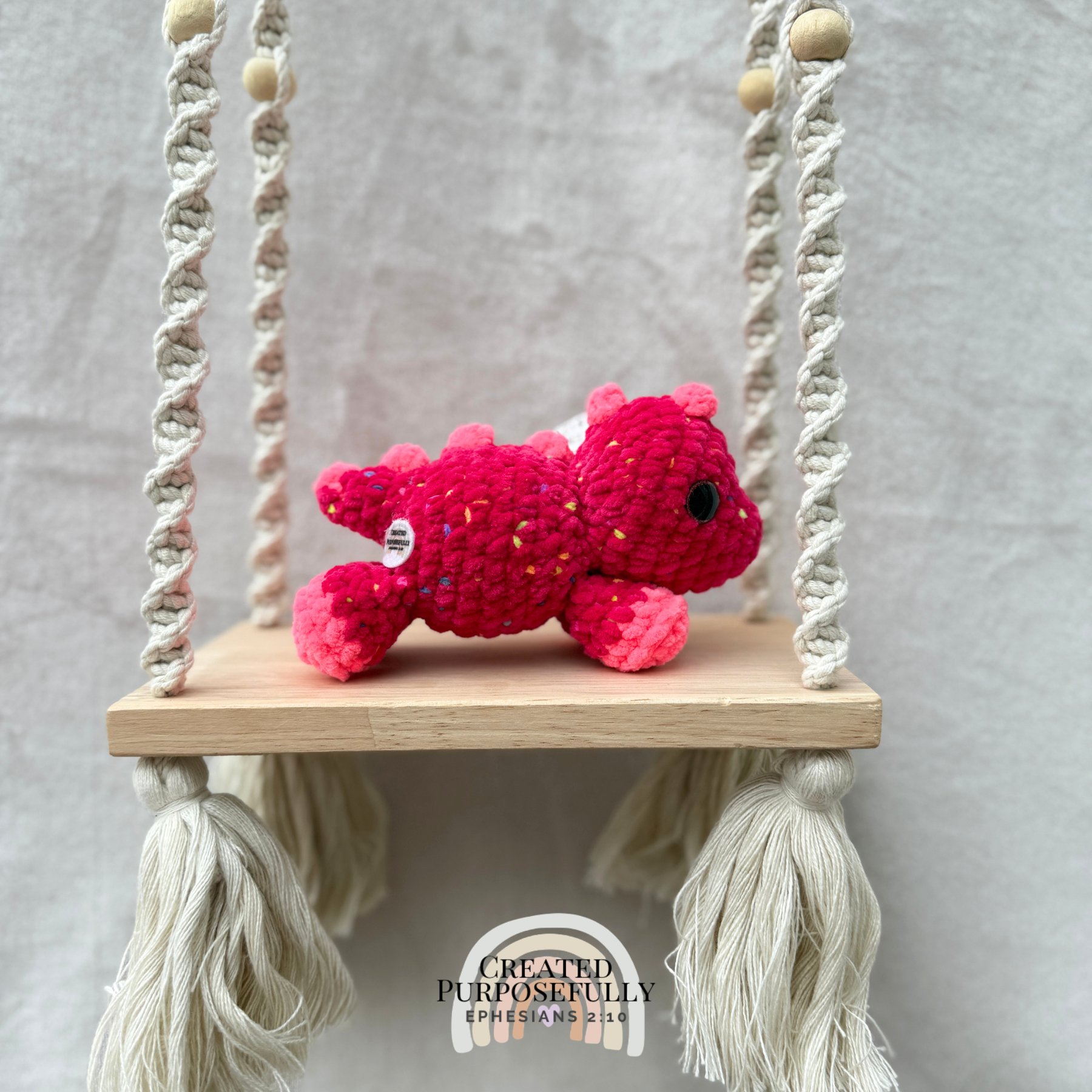 Handmade crochet mini Stegosaurus plush made with soft plush yarn, a cute stuffed dinosaur gift for kids, dino lovers, and plush collectors.
