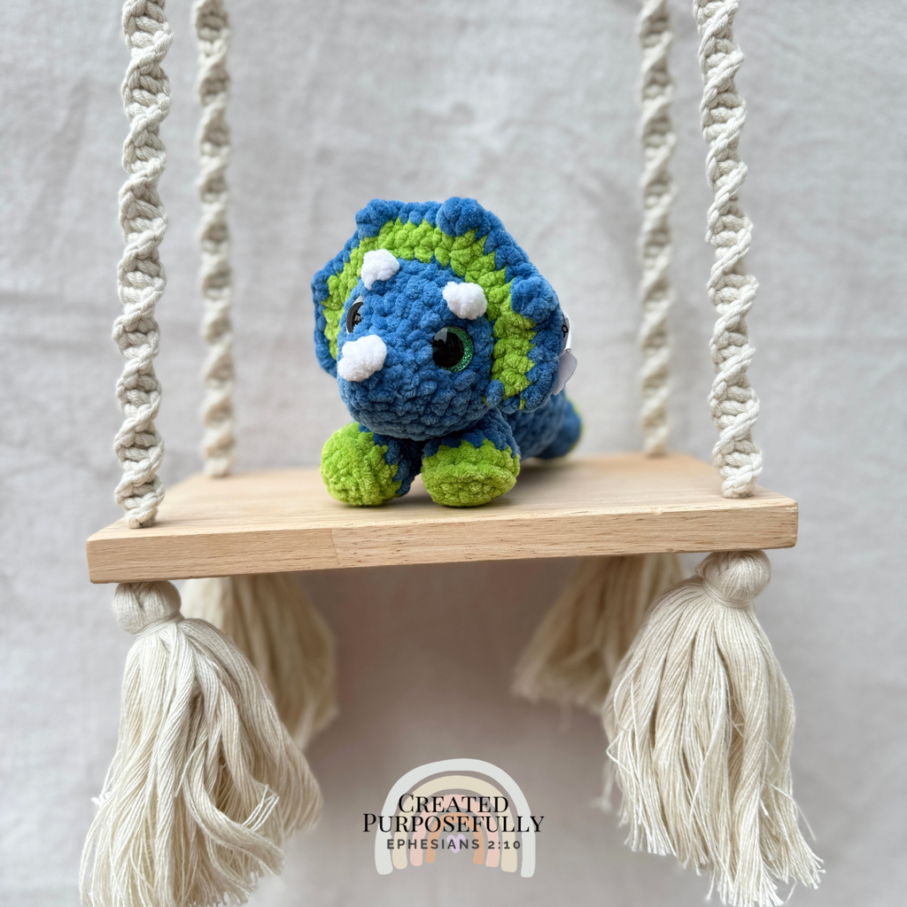 Handmade crochet mini Triceratops plush made with soft plush yarn, a cute stuffed dinosaur gift for kids, dino lovers, and plush collectors.