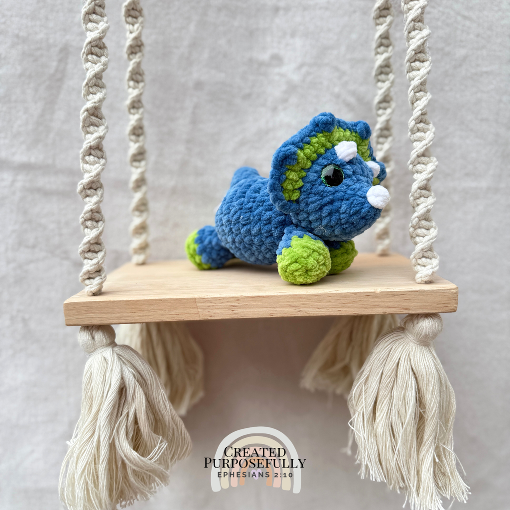 Handmade crochet mini Triceratops plush made with soft plush yarn, a cute stuffed dinosaur gift for kids, dino lovers, and plush collectors.