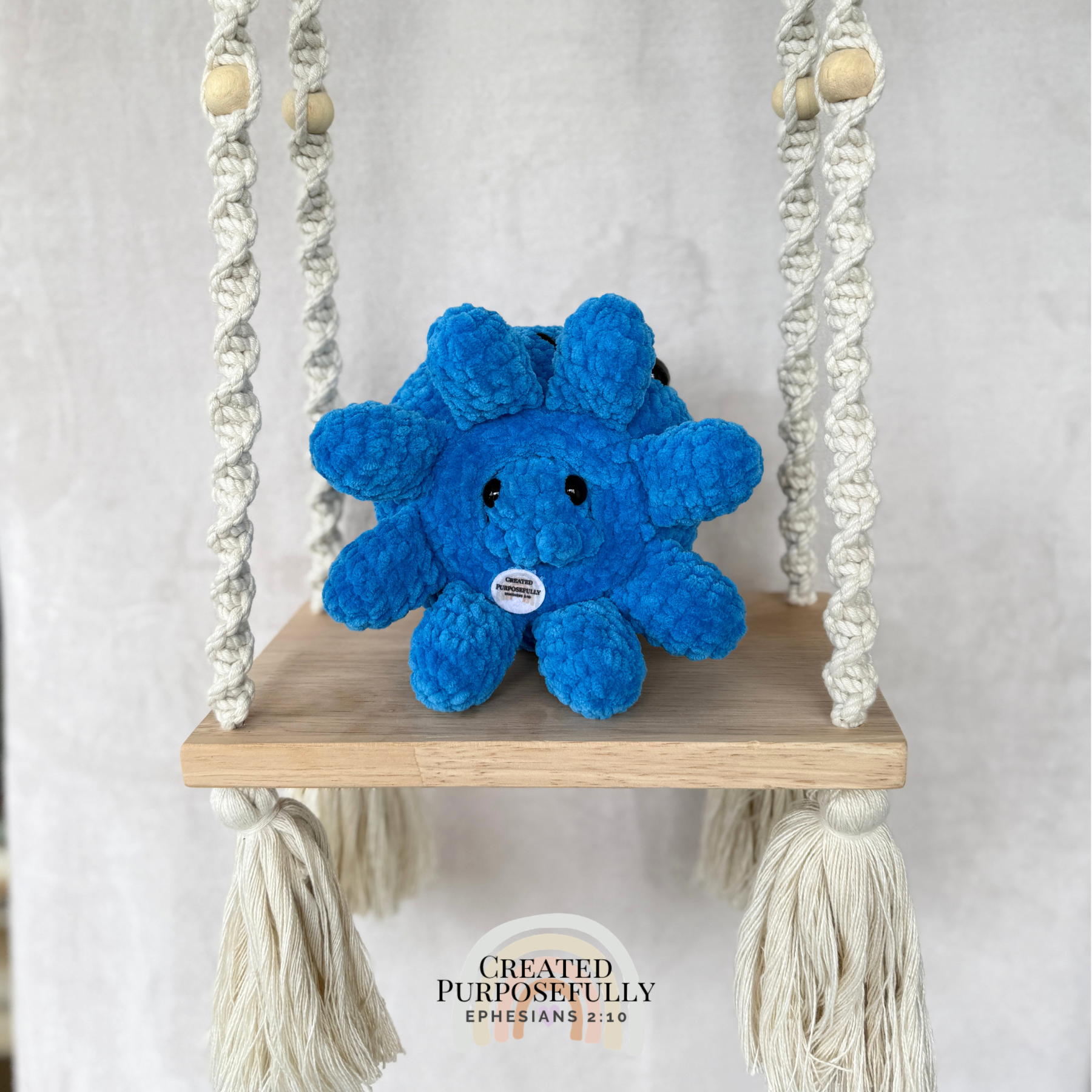 Handmade crochet octopus family plush with one mama octopus and two baby octopuses made with soft blue plush yarn