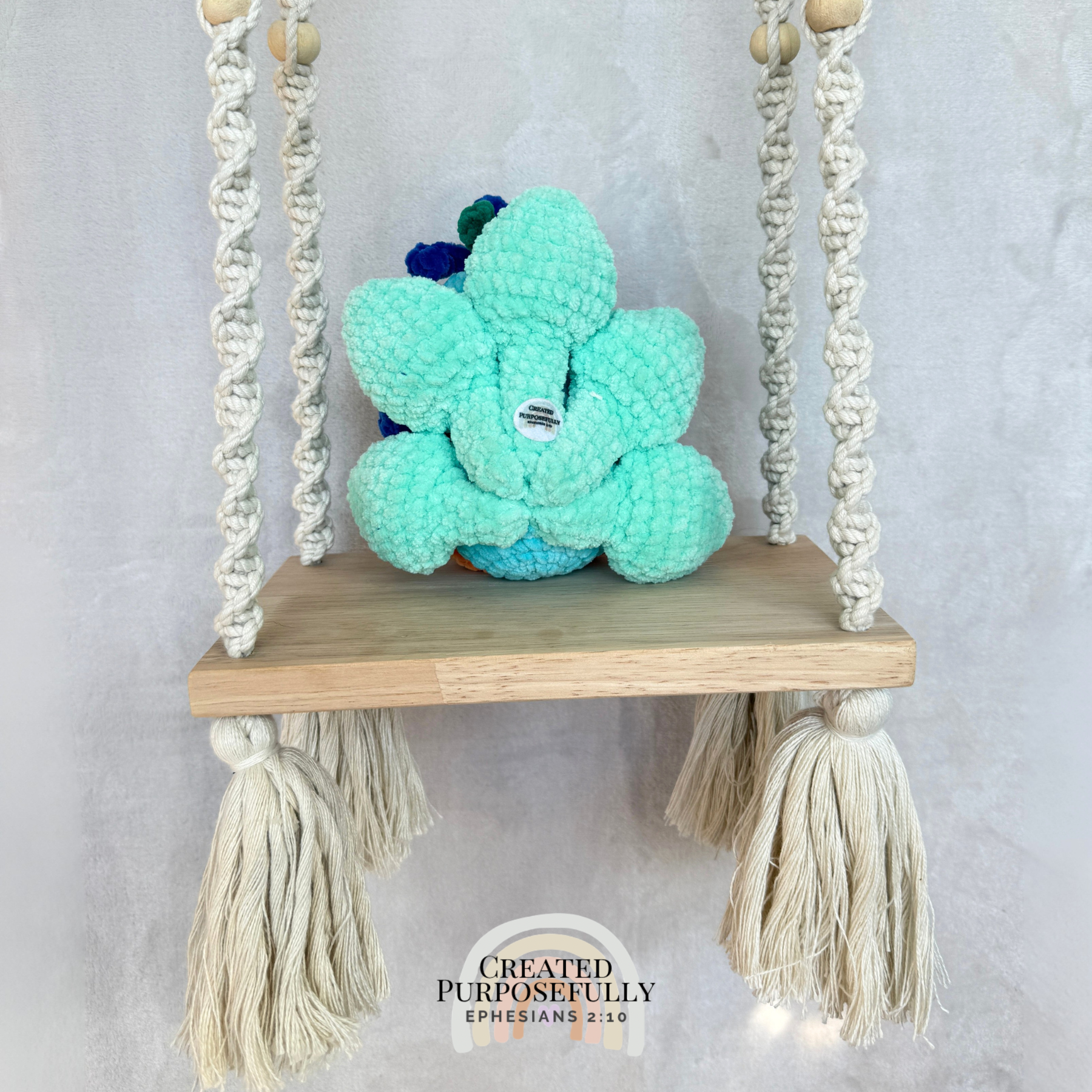 Handmade crochet peacock plush made with soft plush yarn and colorful handmade details