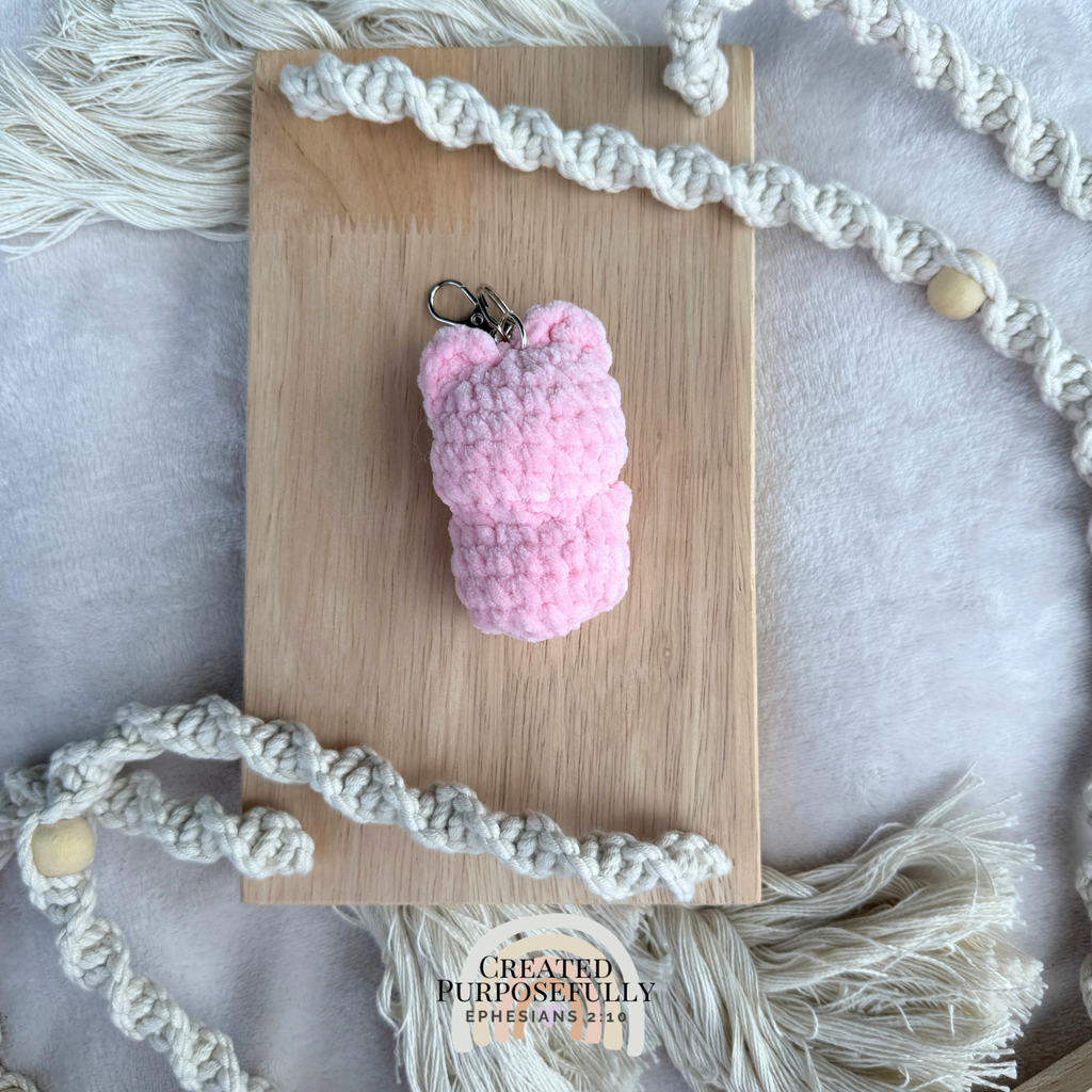 Handmade crochet pig backpack buddy keychain made with soft plush yarn, a cute bag charm for backpacks, purses, keys, and gifts.