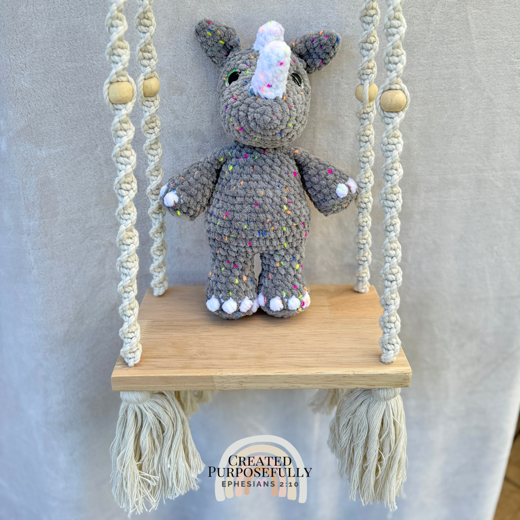 Handmade crochet rhino plush with a small horn made with soft cuddly yarn by Created Purposefully