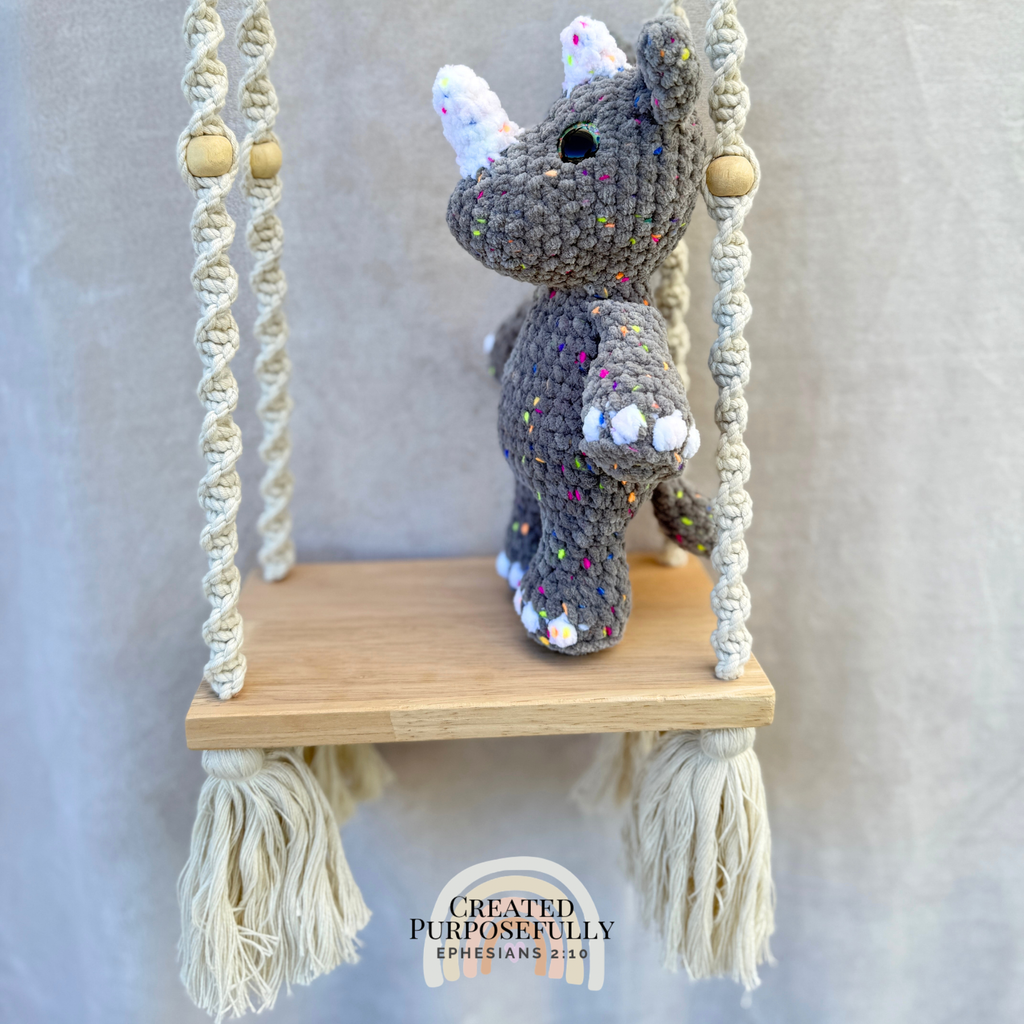 Handmade crochet rhino plush with a small horn made with soft cuddly yarn by Created Purposefully