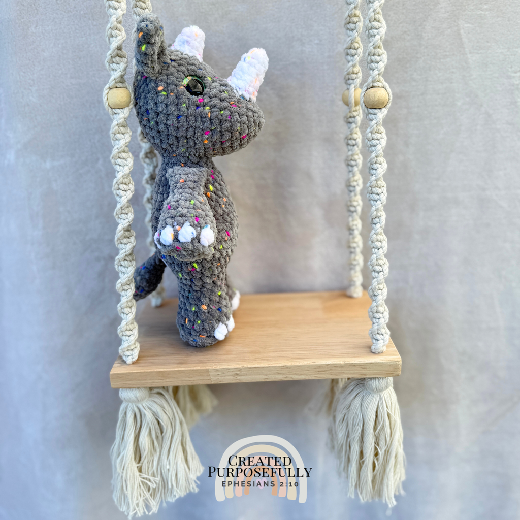 Handmade crochet rhino plush with a small horn made with soft cuddly yarn by Created Purposefully