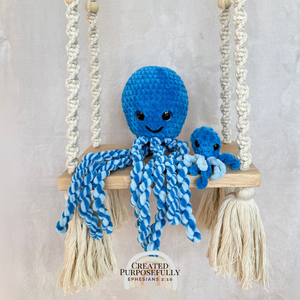 Handmade crochet squid family with one mama squid and two baby squids made with soft plush yarn