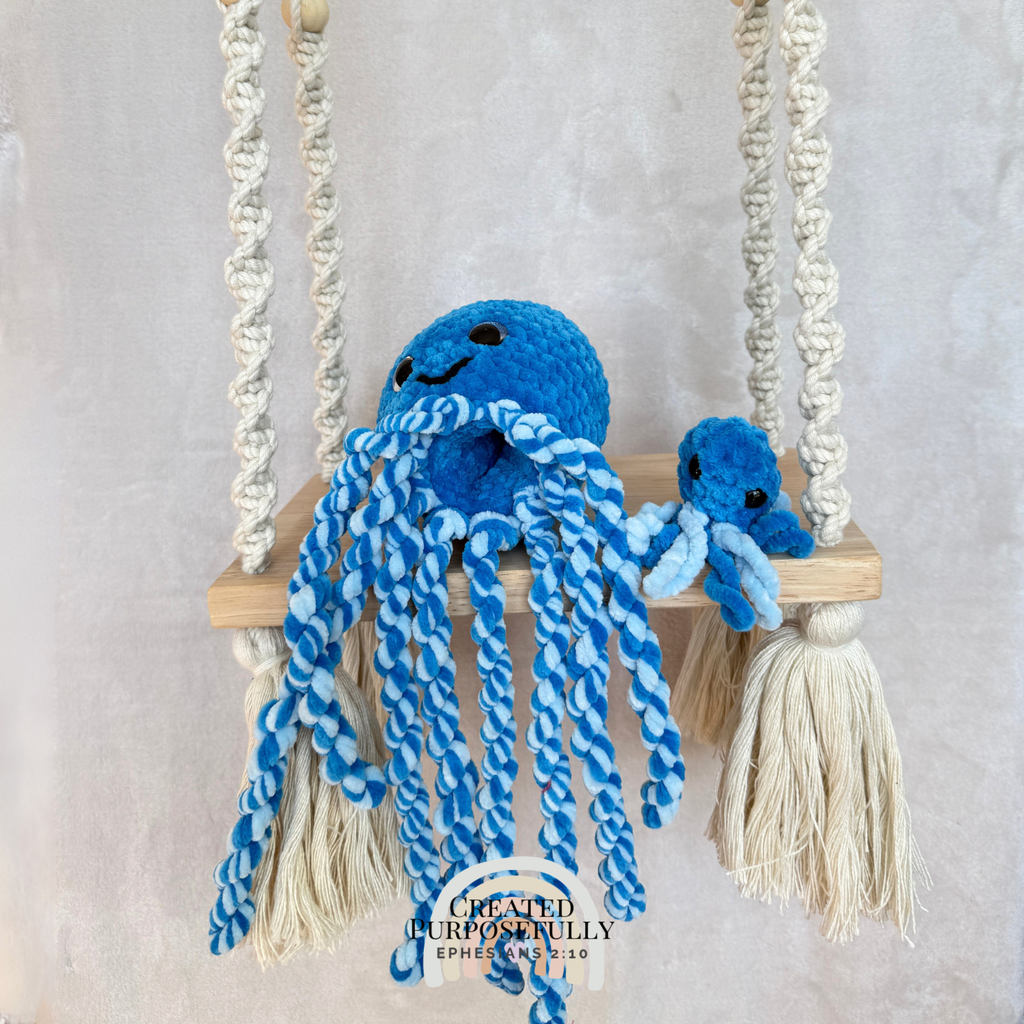 Handmade crochet squid family with one mama squid and two baby squids made with soft plush yarn