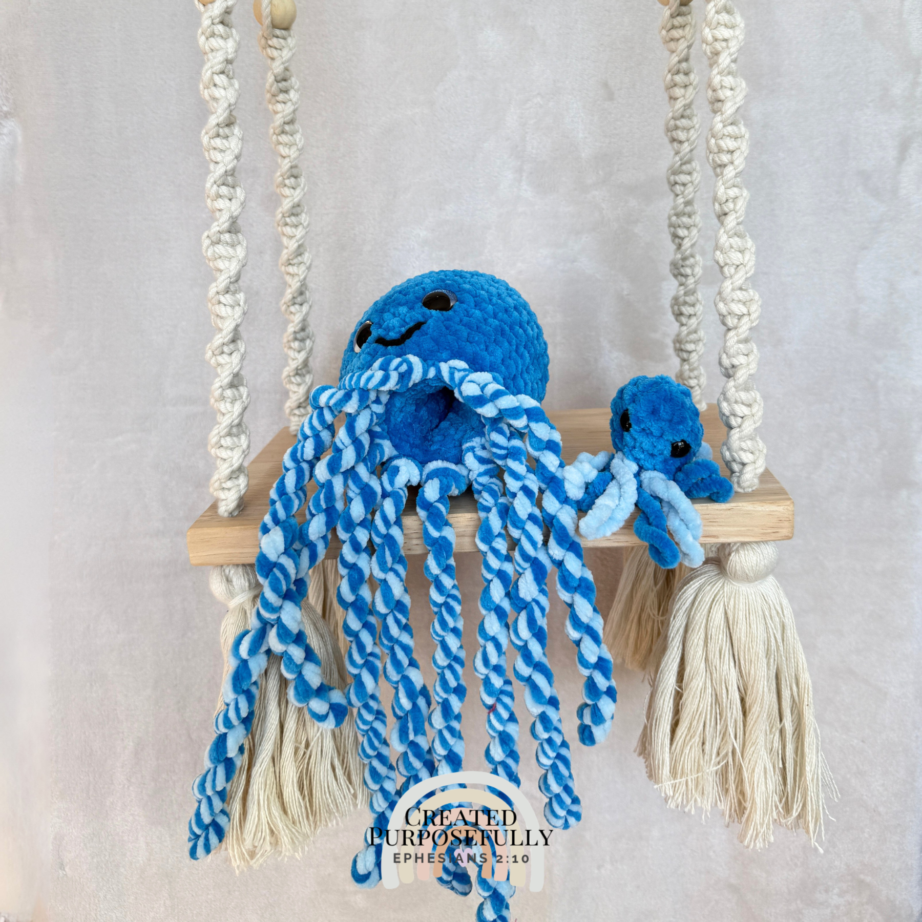 Handmade crochet squid family with one mama squid and two baby squids made with soft plush yarn