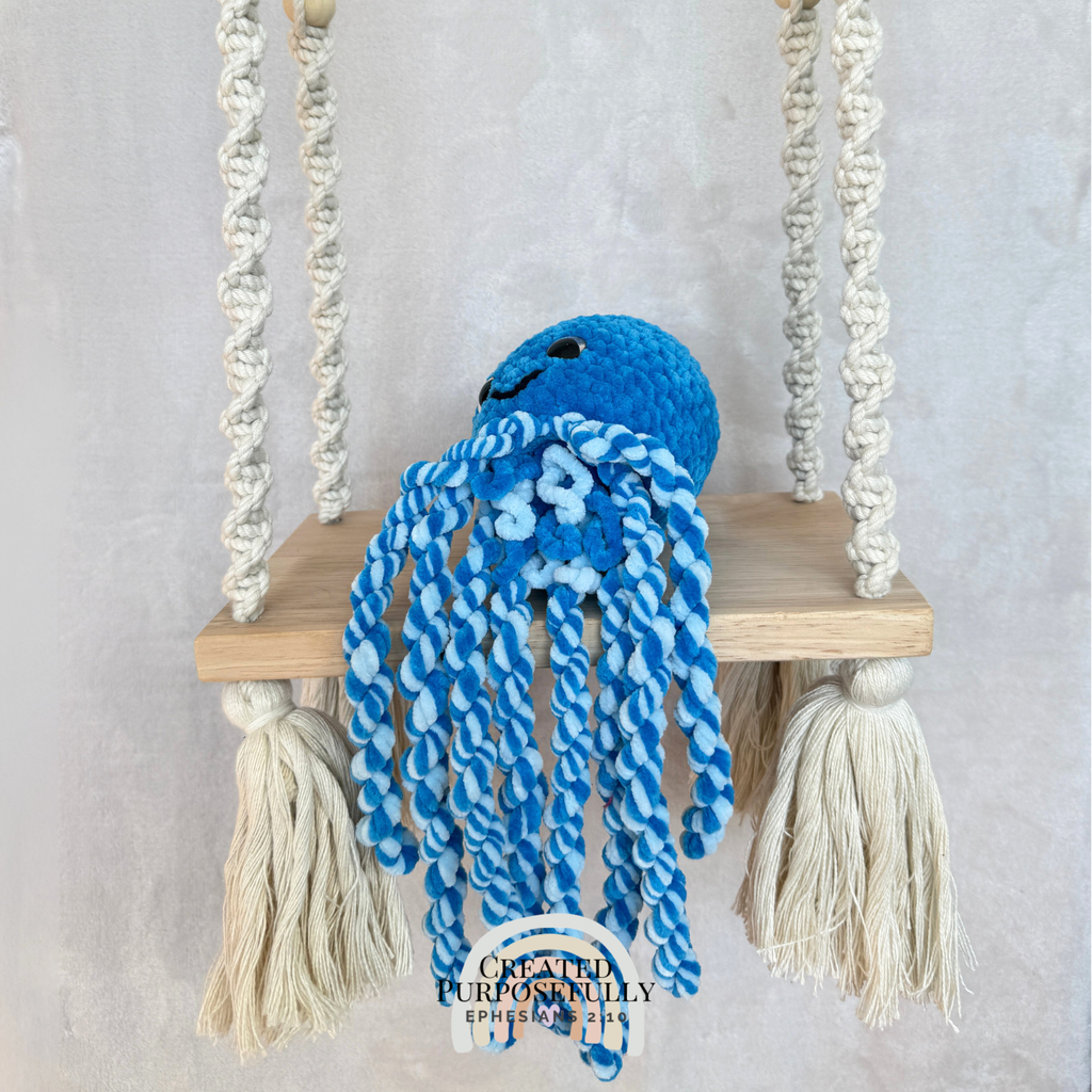 Handmade crochet squid family with one mama squid and two baby squids made with soft plush yarn