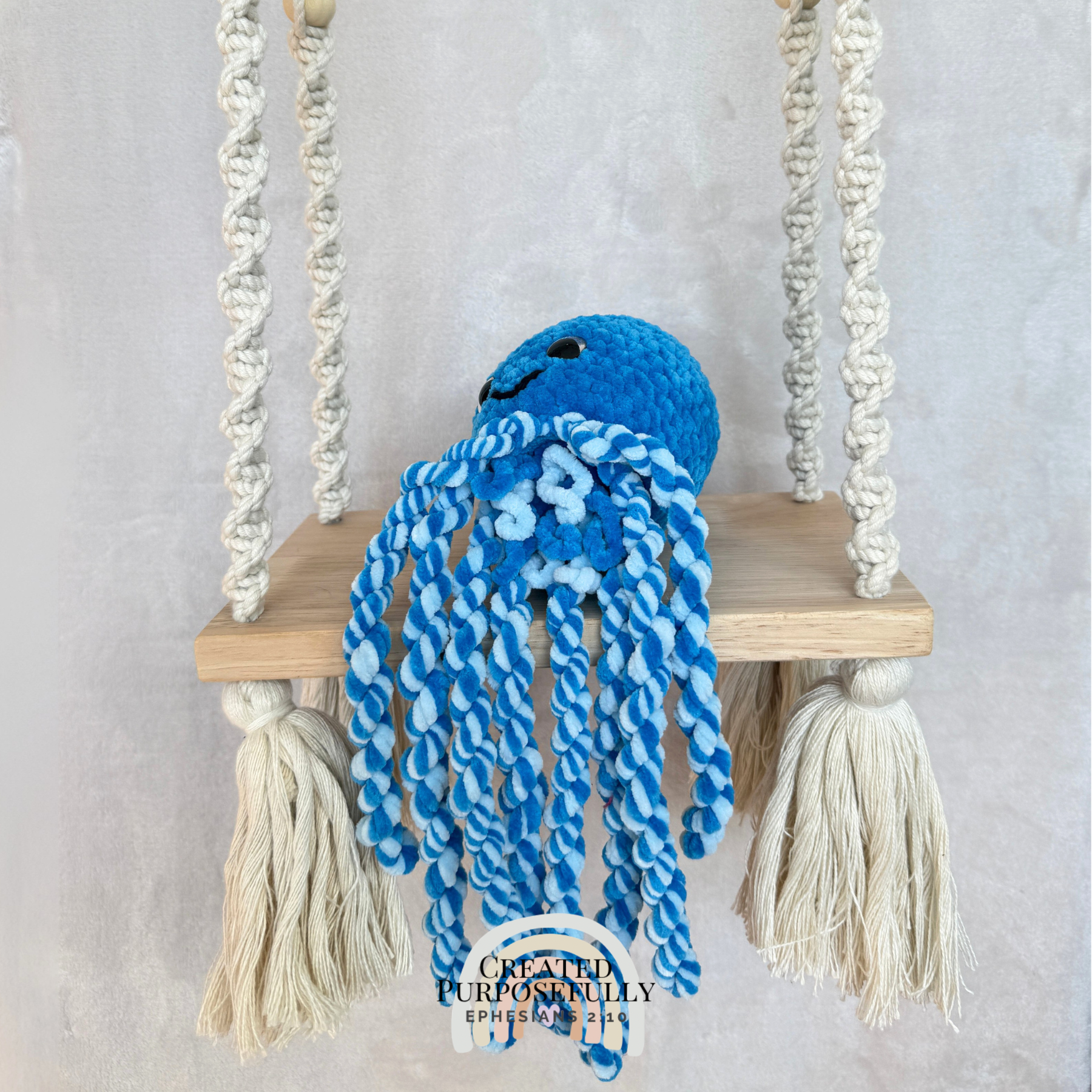 Handmade crochet squid family with one mama squid and two baby squids made with soft plush yarn