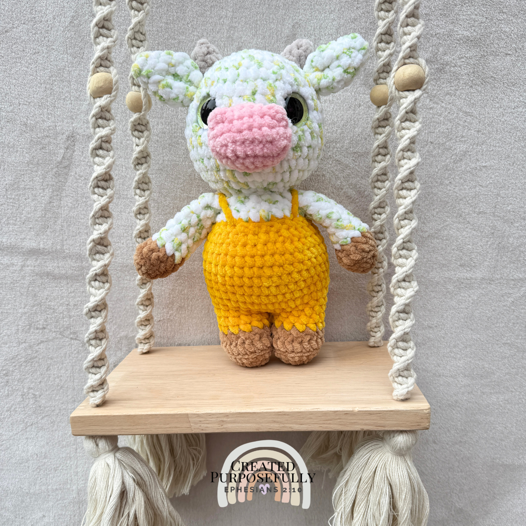 Handmade crochet standing cow made with ultra soft plush yarn. Choose purple, pink, or blue overalls. A sweet gift for cow lovers of all ages.