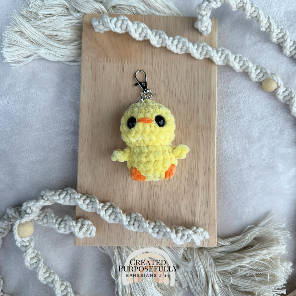 Handmade crochet yellow duck backpack buddy keychain made with soft plush yarn, a cute bag charm for backpacks, purses, keys, and gifts.