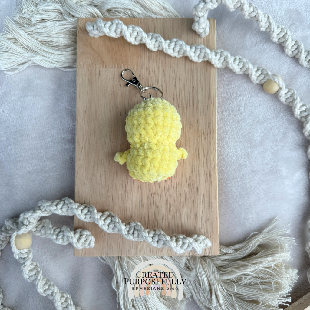 Handmade crochet yellow duck backpack buddy keychain made with soft plush yarn, a cute bag charm for backpacks, purses, keys, and gifts.